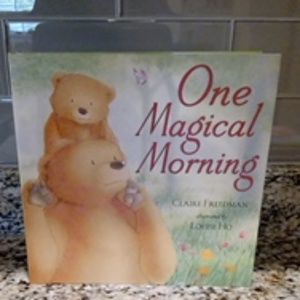 One hard cover book, "One Magical Morning."